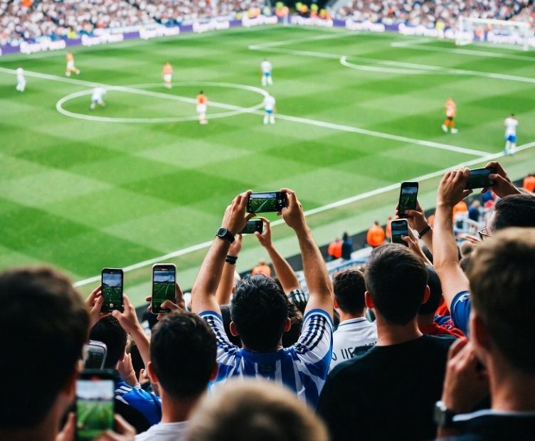 Fans watching a Premier League match